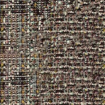 Woven fabric sample, muted brown with mustard, olive, pink, and cream threads, exhibiting a dense, irregular geometric pattern and nubby texture.